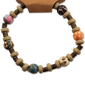 Colorful handcrafted bracelet with engraved brass spacer beads and earth-toned accents on stretch cord – Capstone Hemp